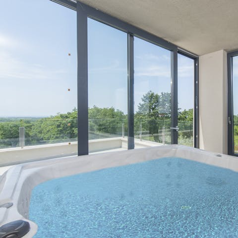 Spend evenings relaxing in the indoor hot tub – a glass of bubbly in hand