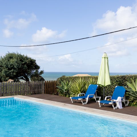 Soak up the sun on a lounger then take a refreshing dip in the swimming pool