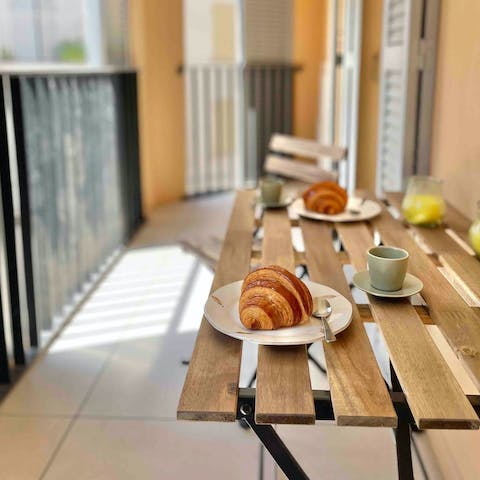 Enjoy a classic French breakfast on the balcony