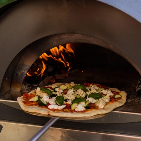 Divulge in some delicious pizza at Pizzeria Capricciosa, only a two–minute walk away