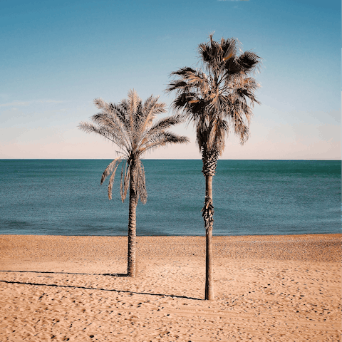 Sink your toes in the sand at the beach, just a short walk away