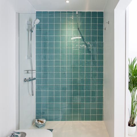 Start any day on a serene note with a soak in the beautifully tiled showers