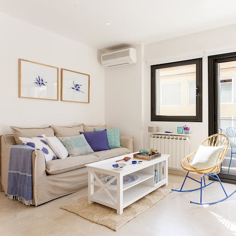 Kick back in the bright living room with a glass of Spanish wine after a day of exploring the city