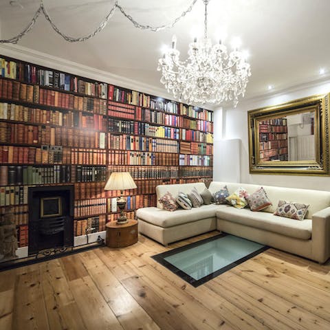 Feel like you're in a world of ideas with the bookcase feature wallpaper