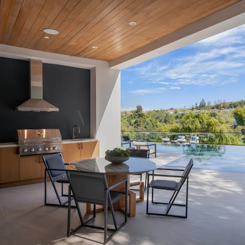 Fire up the grill in the outdoor kitchen and enjoy lunch alfresco