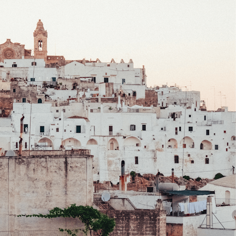 Enjoy strolling through the majestic hilltop town of Ostuni