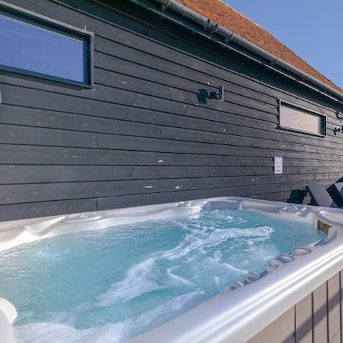 Relax in the Jacuzzi and admire the vineyard views