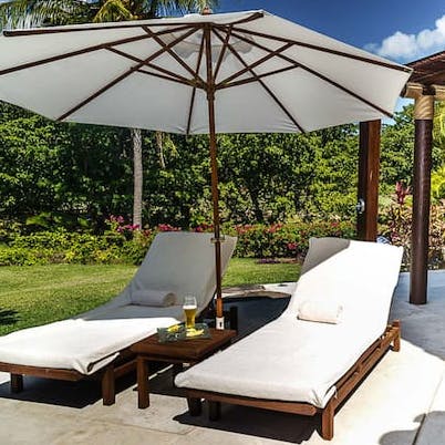 Soak up the sun from a poolside lounger, or doze in a hammock in the shade