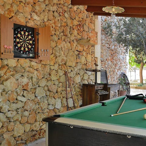 Socialise over a game of pool or darts on the terrace