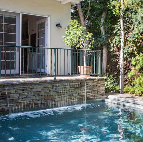 The waterfall-fed swimming pool