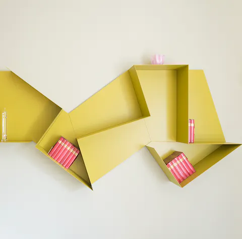 Store your things on the quirky origami shelves