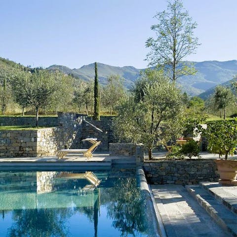 Admire views of the Tuscan countryside from the poolside