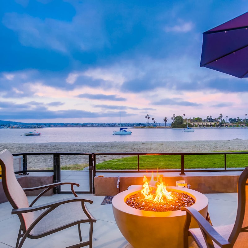 Light the firepit and watch the boats drift past Mission Beach