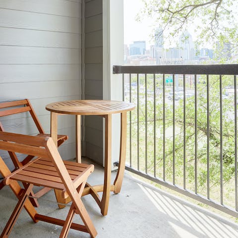 Relax on the private balcony with its Austin skyline views