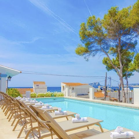 Relax by the fabulous pool with stunning sea views before you 
