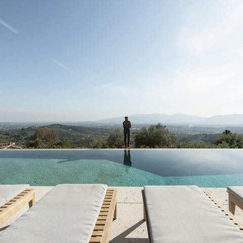 Admire the sweeping views from the infinity pool