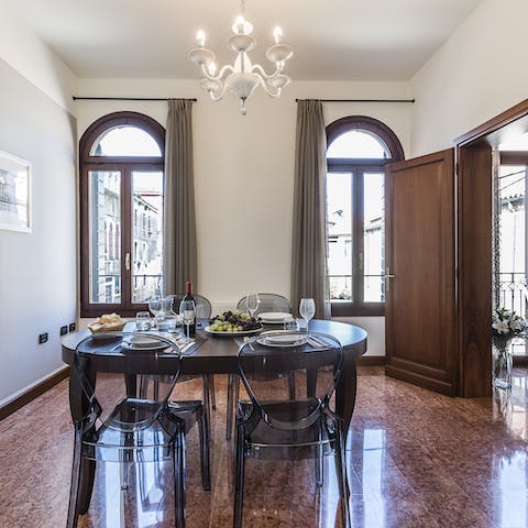 Serve dinner in the opulent surroundings of the apartment's dining area