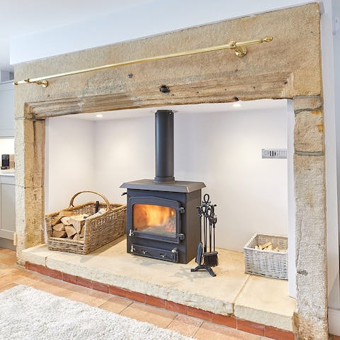 Light up the wood-burning stove in the lounge and gather around the inglenook fireplace