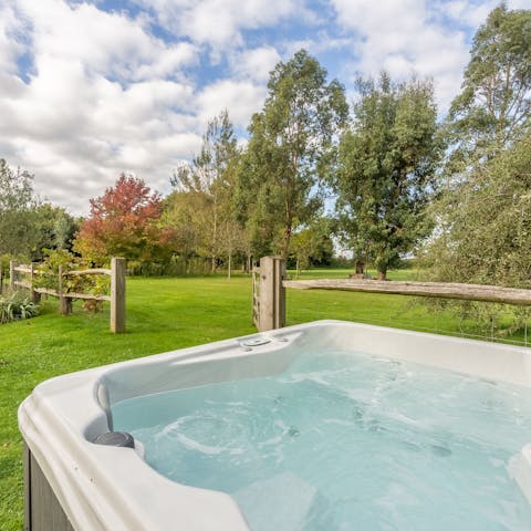 Take in the views of the beautiful gardens from the hot tub
