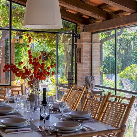 Dine in the conservatory surrounded by greenery