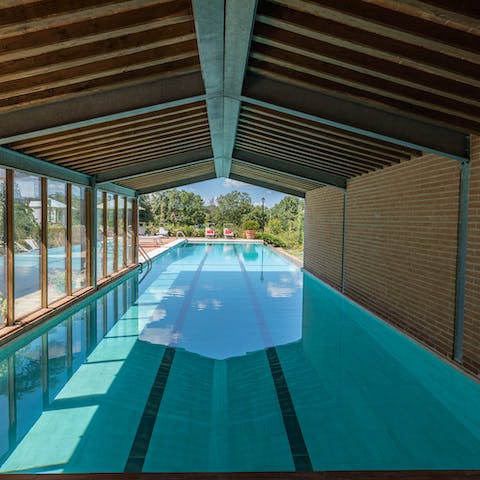 Swim in the indoor and outdoor swimming pool