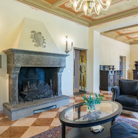 Admire traditional decor of stone fireplaces and frescoed walls