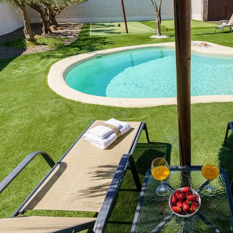 Sip your drink while lounging by the pool