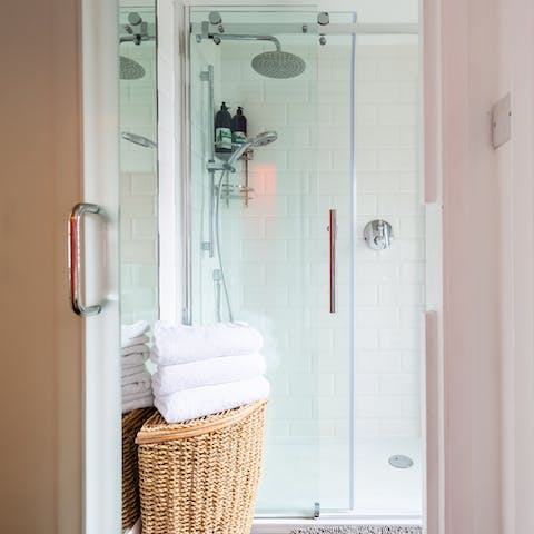 Relax with a soak under the rainfall shower using the Neal's Yard toiletries provided