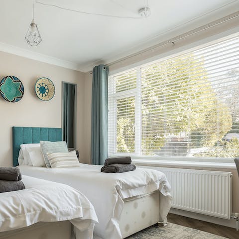 Wake up peacefully to leafy, green views from the enormous bedroom window