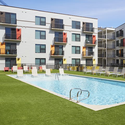 Lounge out by the building's resort-style pool