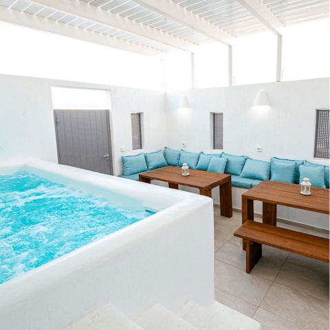 Luxuriate in your sheltered jacuzzi or gather for drinks in the evening