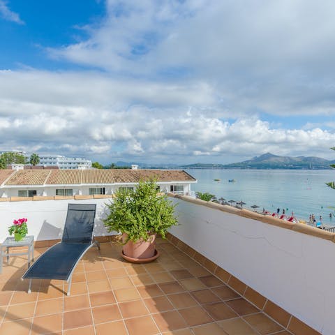 Laze on loungers in the sun on your private rooftop terrace and enjoy stunning sea views