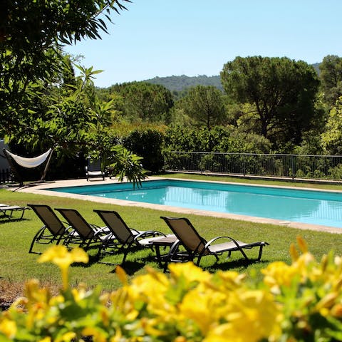 Admire the views across the hills from the sparkling communal pool