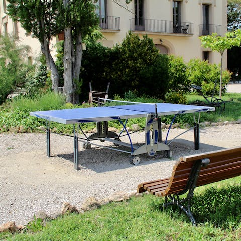 Play a round of table tennis in the sunny garden