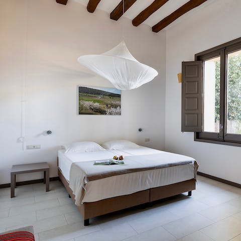 Rest up after a long walk through Catalonia's countryside in the old-world bedroom