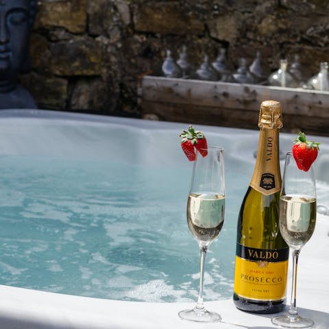 Take a luxurious soak in the private sunken hot tub 