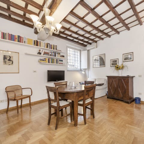 Gather together for a homemade Italian feast under the living area's picturesque beams