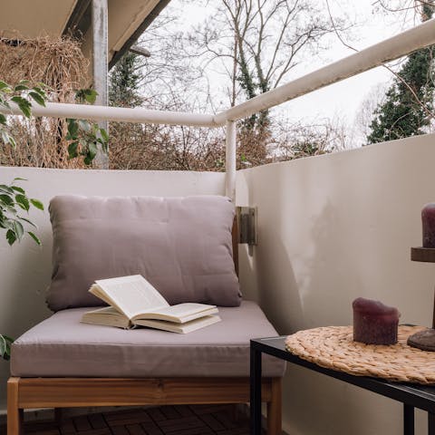 Find a moment to read and a relax on the little balcony 