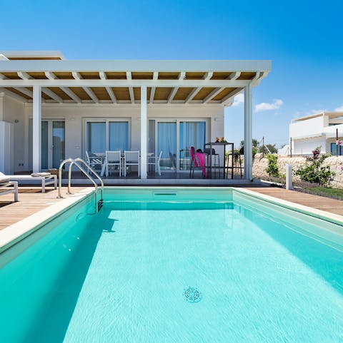 Dive into one of three private pools spread out between the villas