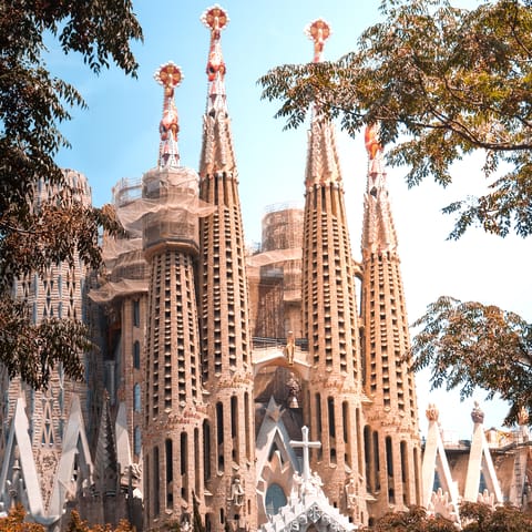 Visit Barcelona's emblematic Sagrada Familia, an eighteen-minute walk away 