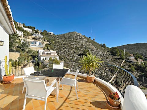 Enjoy some drinks and snacks in view of the Moraira mountains
