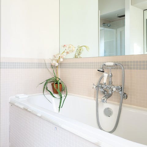 Unwind after a busy day with a soak in the master bathtub