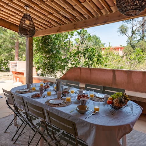 Cook up some delicious barbecued French meats and tuck in at your shaded alfresco dining setup