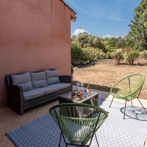 Relax and unwind with a sundowner on your outdoor lounge seating area