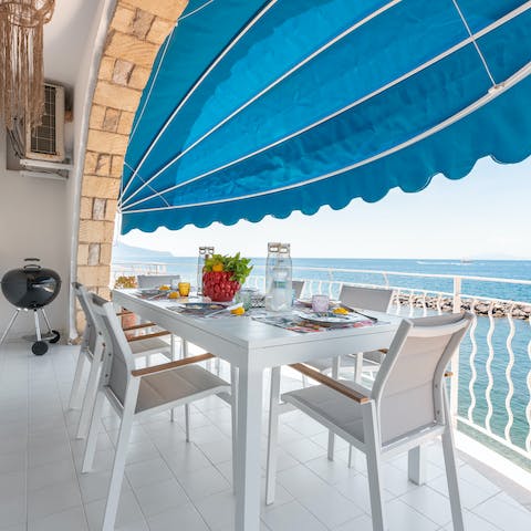 Gather on the balcony for a barbecue lunch under the shade of the awning