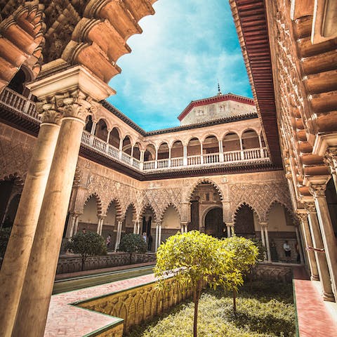 Take a stroll over to visit the historic Royal Alcázar of Seville