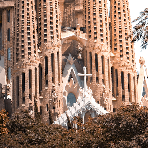 Admire the stunning architecture of La Sagrada Familia – a seventeen–minute walk away