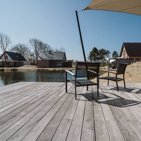 Enjoy your morning coffee out on the decking, overlooking the calm pond and sand dunes