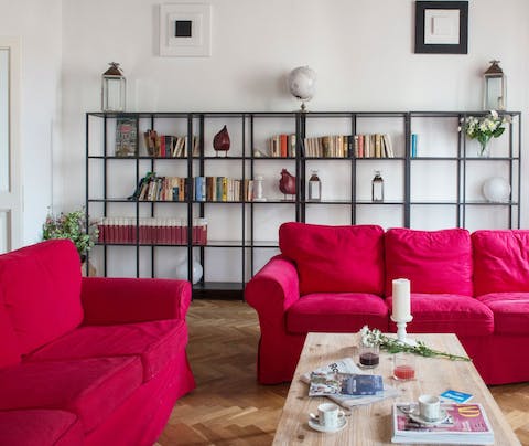 Relax on the vibrant sofas after a whirlwind day exploring the city