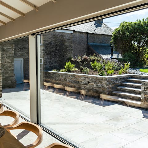 Enjoy the fruits of your labour in this stunning dining area that leads out to the garden